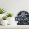 JURASSIC WORLD - Tirelire En Résine - 17x14,5x 6 Cm